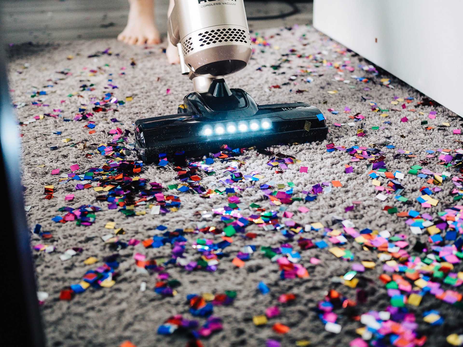 A vacuum cleaning up confetti after a party