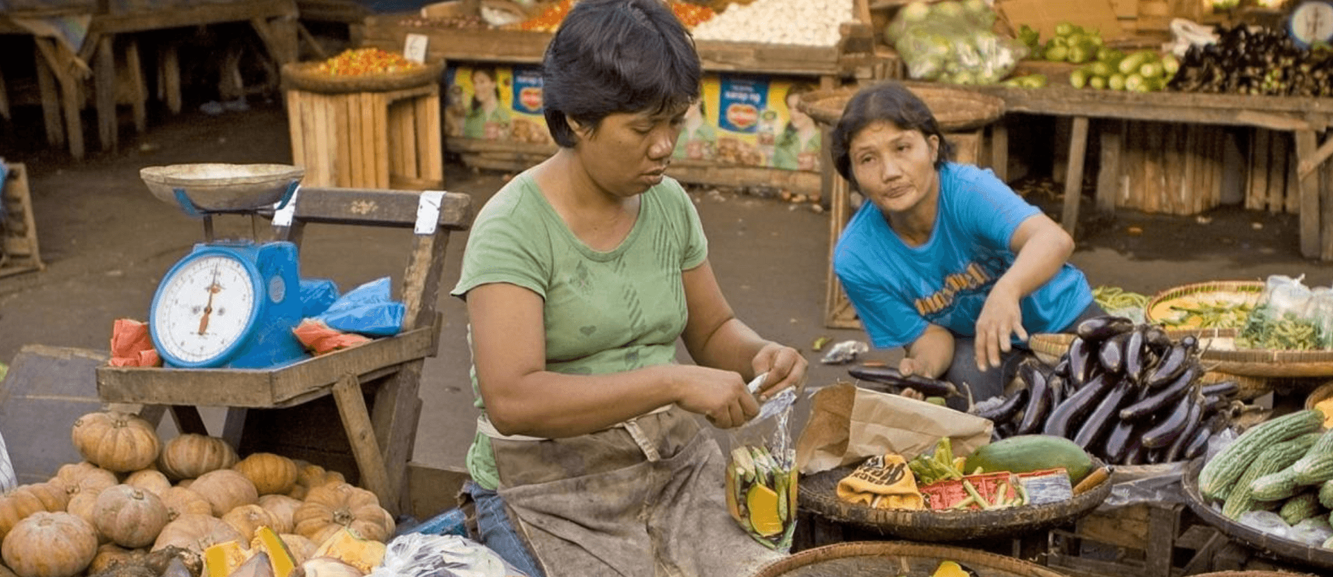 Two women in food market