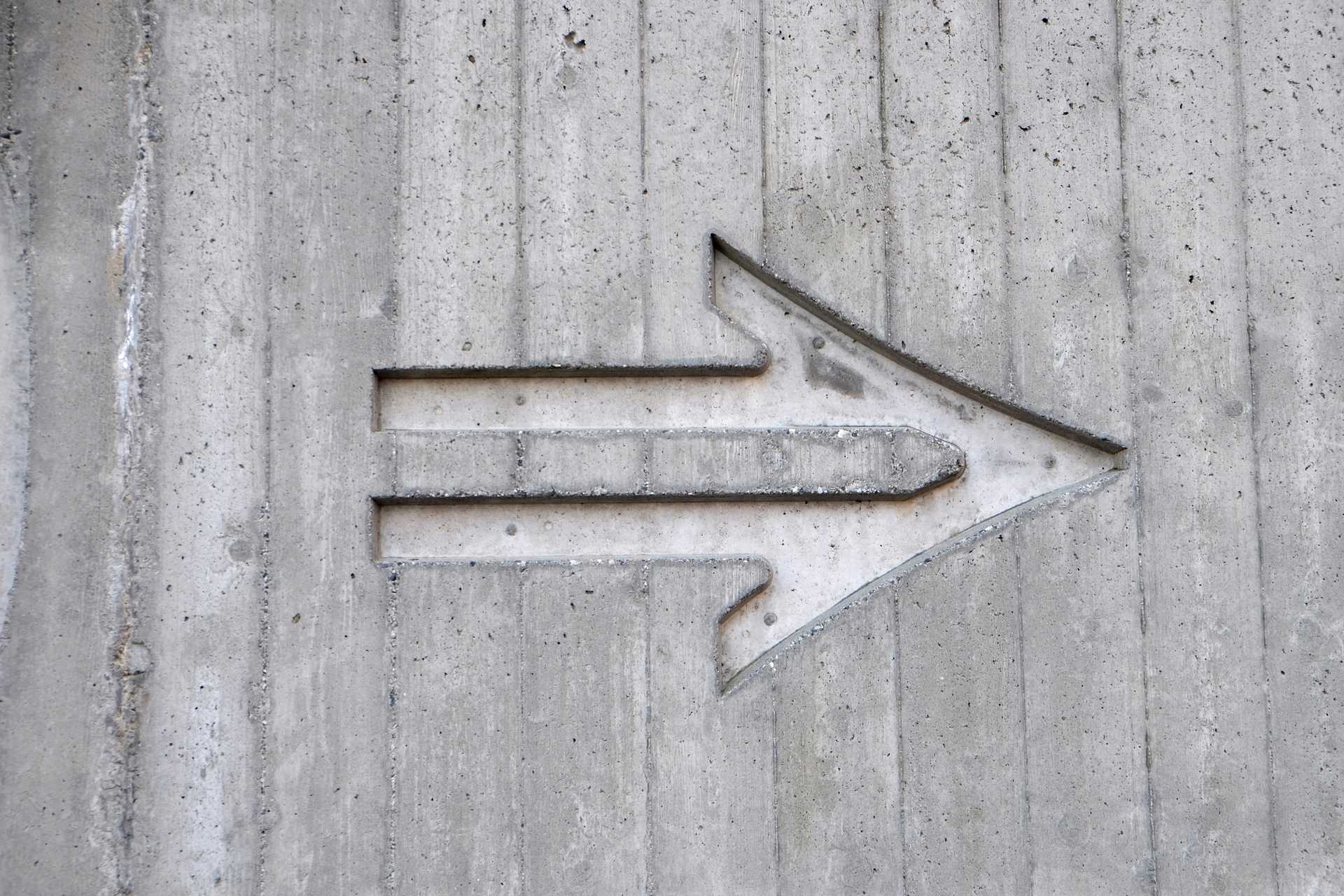 arrow carved into wall