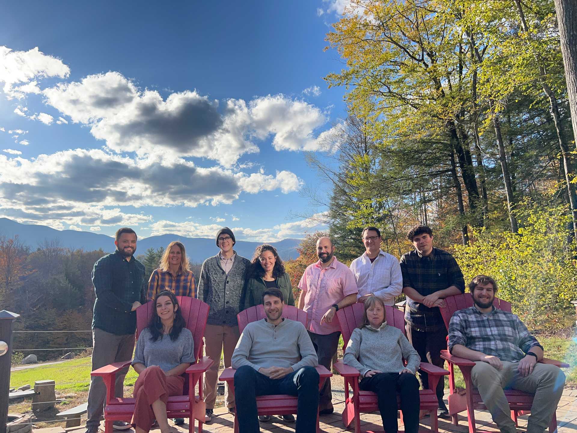 All Redfin Solutions employees gathered outside with New Hampshire's White Mountains in background